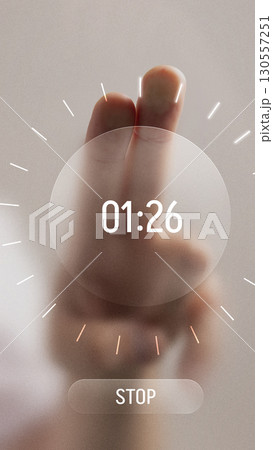 Bold digital artwork. Hand with two fingers pressing futuristic digital timer interface showing countdown Bold digital artwork. Hand with two fingers pressing futuristic digital timer interface showing countdown 130557251