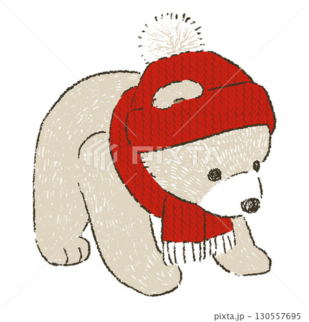 赤いニットの帽子とマフラーをつけた茶色いテディベア 130557695