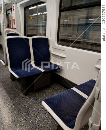 Empty modern subway car with blue seats 130557985