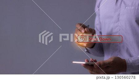 Young man with smartphone hand using a pen touching Shut Down button press power OFF Young man with smartphone hand using a pen touching Shut Down button press power OFF 130560278