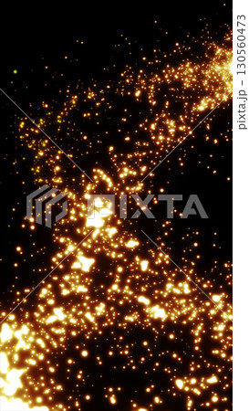 Glowing golden particles swirling through a dark void, forming a luminous trail with a sense of dynamic motion 130560473