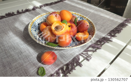 Fruits on porcelain plate with blue pattern. Food and vitamins, healthy eating. Seasonal food. 130562707