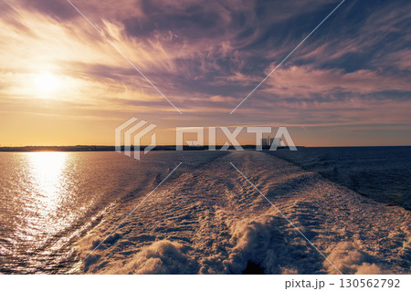 Beautiful bright sunset on the sea and waves from the ship Beautiful bright sunset on the sea and waves from the ship 130562792