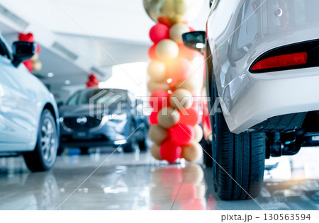 Car parked in luxury showroom. Car dealership office. Car showroom business. New car parked in modern showroom. Auto for sale and rent business. Automobile leasing and insurance. Electric automobile. 130563594