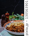 Delicious hungarian goulash with spaetzle on rustic table setting 130563901
