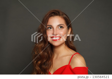 Attractive brunette woman with trendy make-up and brown curly hair wavy hairstyle Attractive brunette woman with trendy make-up and brown curly hair wavy hairstyle 130564521