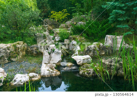 beautiful stream among stones in Chinese park 130564614