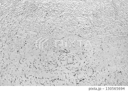 Cracked shattered glass window texture Cracked shattered glass window texture 130565694