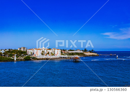 view of the beach and the sea with boats view of the beach and the sea with boats 130566360
