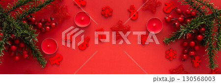 Red Christmas background with fir branches Red Christmas background with fir branches 130568003