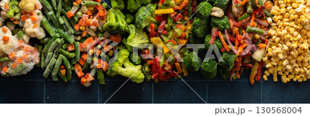 Eye-catching banner with frozen fruits and vegetables, emphasizing the vibrant, seasonal process of freezing healthy produce for winter, ideal for health-related advertisements Eye-catching banner with frozen fruits and vegetables, emphasizing the vibrant, seasonal process of freezing healthy produce for winter, ideal for health-related advertisements 130568004