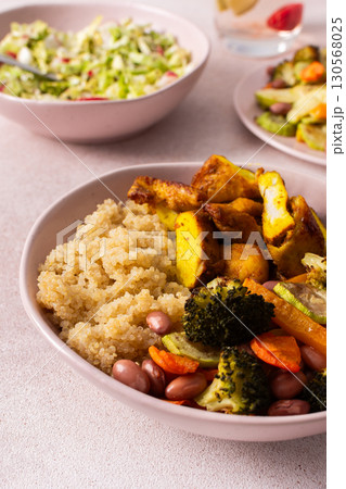 A well-balanced breakfast spread showcasing quinoa, baked sweet potato with carrots, zucchini, broccoli, beans, and baked chicken breast seasoned with turmeric A well-balanced breakfast spread showcasing quinoa, baked sweet potato with carrots, zucchini, broccoli, beans, and baked chicken breast seasoned with turmeric 130568025