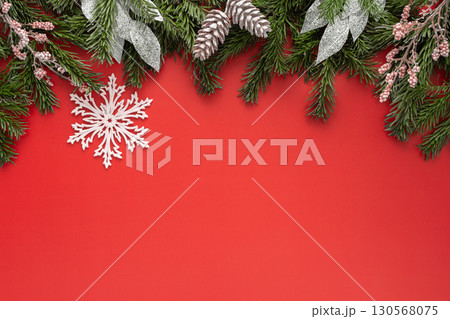 Red Christmas background with fir branches 130568075