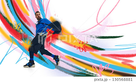 Graphic composition. Male model in blue outfit posing with dynamic colorful graffiti background Graphic composition. Male model in blue outfit posing with dynamic colorful graffiti background 130568881