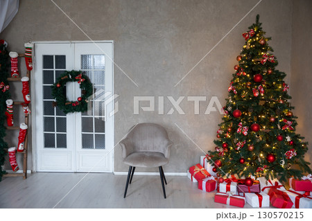 interior christmas. magic glowing tree and gifts interior christmas. magic glowing tree and gifts 130570215
