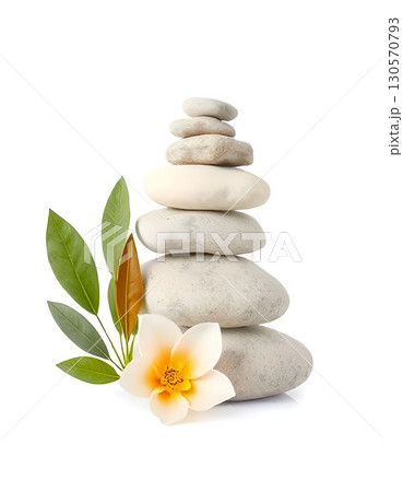 Balanced stack of white spa stones with green leaves and delicate white flower on a white background 130570793