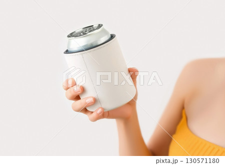 Hand holding white koozie with silver can mockup, ai generated 130571180