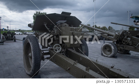 A historical cannon stands prominently against a dramatic sky, showcasing military power amid a setting that reflects Russia's war efforts and artillery history. 130571331