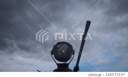 A cannon stands prominently against a turbulent sky, illustrating the gravity of conflict in Russia. Dark clouds loom overhead, hinting at the tension of war, while the cannon is ready for action. A cannon stands prominently against a turbulent sky, illustrating the gravity of conflict in Russia. Dark clouds loom overhead, hinting at the tension of war, while the cannon is ready for action. 130571337