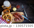 Bavarian sausages with pretzels and beer 130571505