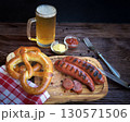 Bavarian sausages with pretzels and beer 130571506