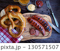 Bavarian sausages with pretzels and beer 130571507
