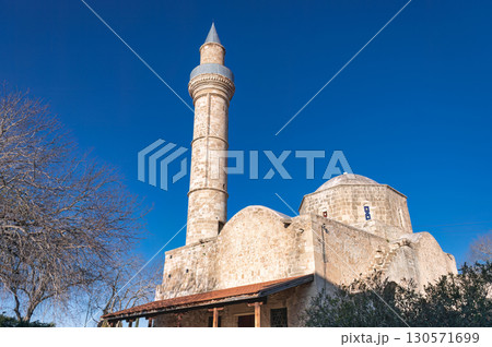 Djami Kebir mosque rising over Paphos under blue sky Djami Kebir mosque rising over Paphos under blue sky 130571699