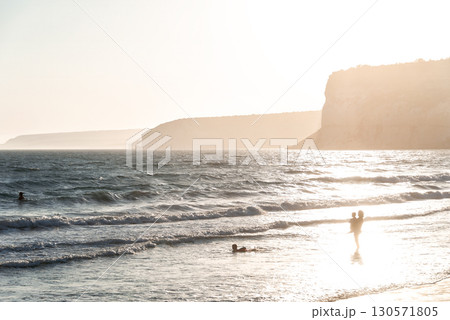 Family enjoying sunset at Kourion beach in Cyprus 130571805