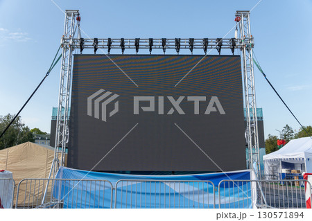 Large LED screen displaying stage performance 130571894