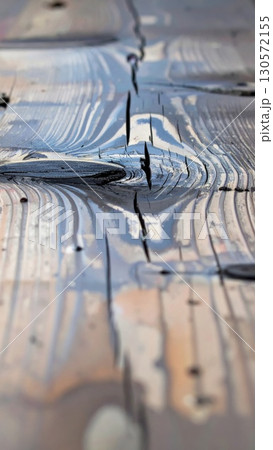 Close up Wooden Table Surface with Natural Patterns in a Dark Brown Stain Finish Vertical 130572155