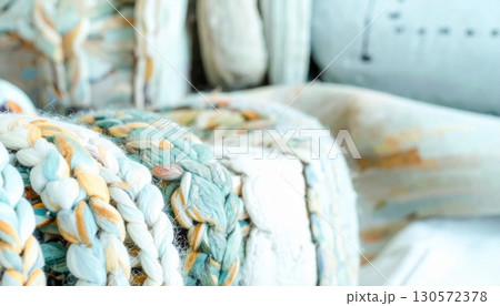Close Up of Abstract Braided Chair with Blue and Yellow Patterned Upholstery 130572378