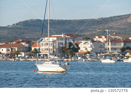 White sailboat floating on calm water in rogoznica, croatia 130572778