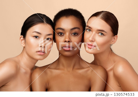 Natural Beauty Concept. Three Pretty Girls Posing Shirtless On Gray Studio Background, Looking At Camera 130574533