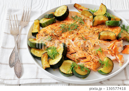 freshly baked salmon fillet with zucchini and dill freshly baked salmon fillet with zucchini and dill 130577418