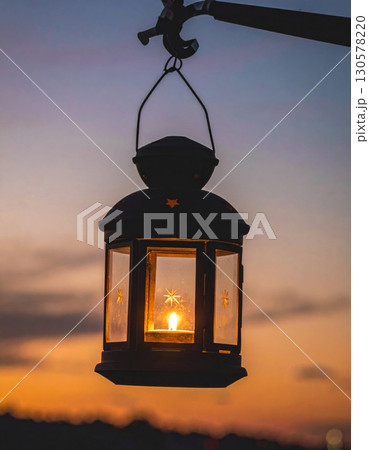 Illuminated Lantern at Sunset 130578220