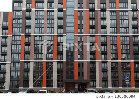 Modern high-rise apartment buildings in a bustling residential area highlighting rental and mortgage Modern high-rise apartment buildings in a bustling residential area highlighting rental and mortgage 130580094