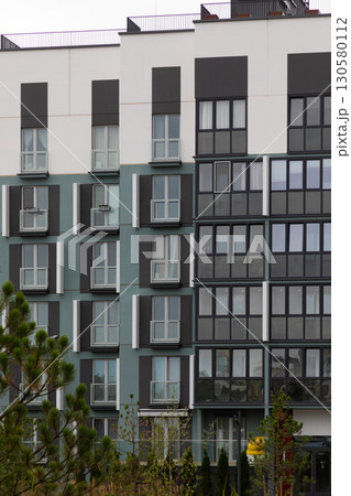 High-rise apartment building in a modern residential area with multiple rental options and property High-rise apartment building in a modern residential area with multiple rental options and property 130580112