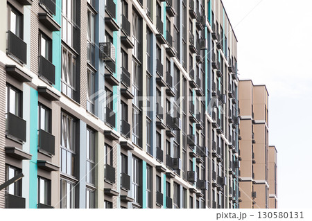 High-rise apartment buildings in a modern residential area showcasing diverse rental and mortgage High-rise apartment buildings in a modern residential area showcasing diverse rental and mortgage 130580131