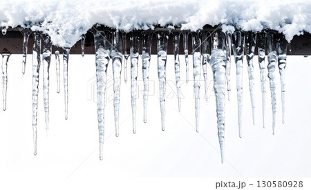 Close-up of Icicles Hanging from a Snowy Roof Close-up of Icicles Hanging from a Snowy Roof 130580928