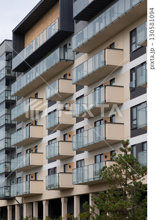 Modern high-rise apartment buildings in a residential area highlighting balcony designs and urban 130581094