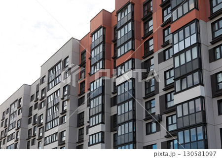 High-rise apartment buildings in a residential area showcasing modern design and typical features of High-rise apartment buildings in a residential area showcasing modern design and typical features of 130581097
