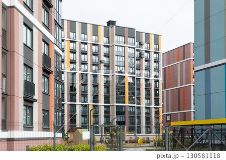 Modern high-rise apartment buildings in a residential area showcasing diverse architecture and urban 130581118