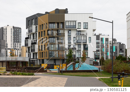 High-rise apartment buildings in a modern residential area showcasing rent, mortgage, and property High-rise apartment buildings in a modern residential area showcasing rent, mortgage, and property 130581125
