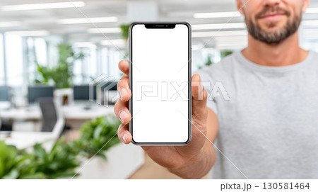 Man Holding Smartphone with Blank Screen 130581464