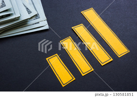 Growing chart with cash nearby. Personal savings. 130581851