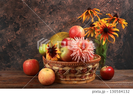 Autumn harvest concept, old wooden table with pumpkins, melons, apples, pears and grapes, thanksgiving day background, healthy ecological food, rustic style, selective focus Autumn harvest concept, old wooden table with pumpkins, melons, apples, pears and grapes, thanksgiving day background, healthy ecological food, rustic style, selective focus 130584132