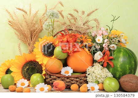 Thanksgiving, autumn background with seasonal nature autumn berries, watermelons, melons, wheat, apples and flowers on wooden background, top view, copy space, flat lay. Happy Thanksgiving concept, 130584379
