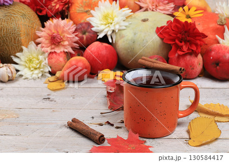 Autumn background with hot tea with cinnamon, mulled wine on wooden background, copy space, selective focus. Happy Thanksgiving concept, postcard. Harvesting, 130584417