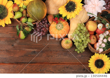 Happy Thanksgiving concept, autumn background with seasonal fall nature berries, pumpkins, melons, apples, grapes and flowers on wooden background, top view, copy space, flat lay. , selective focus. 130584446