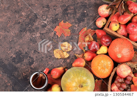 Autumn background with seasonal pears, pumpkins, apples and flowers on a wooden background, top view, copy space, flat lay. Happy Thanksgiving concept, selective focus. 130584467
